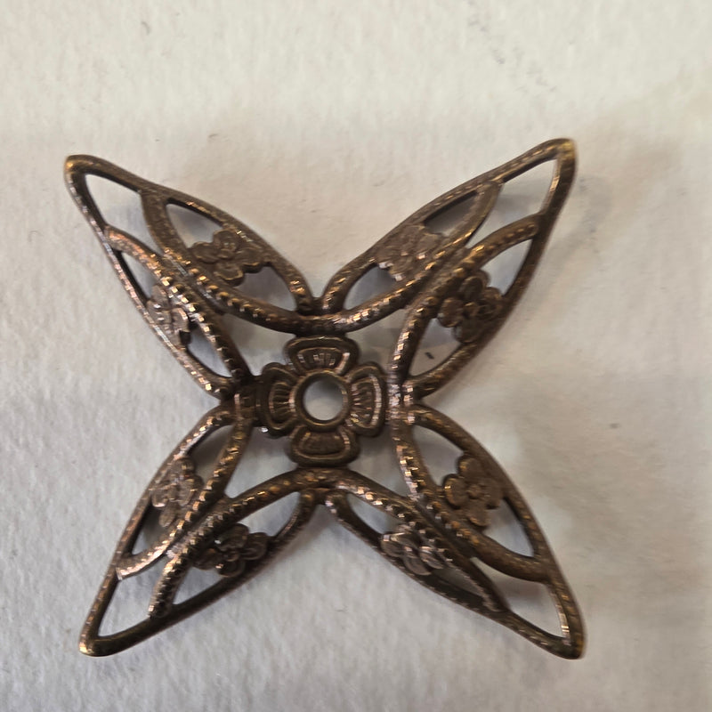 Metallic flower filigree with old silver bath