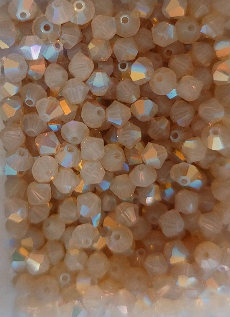 Swarovski tupi 4mm 25ud Sand Opal AB SWAROSKI CENTROARTESANO