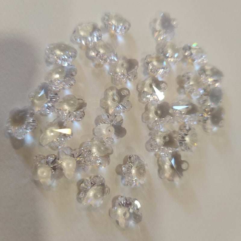 Swarovski Flor de 12mm agujero de 1,2mm en petalo color Cristal SWAROVSKI CENTROARTESANO